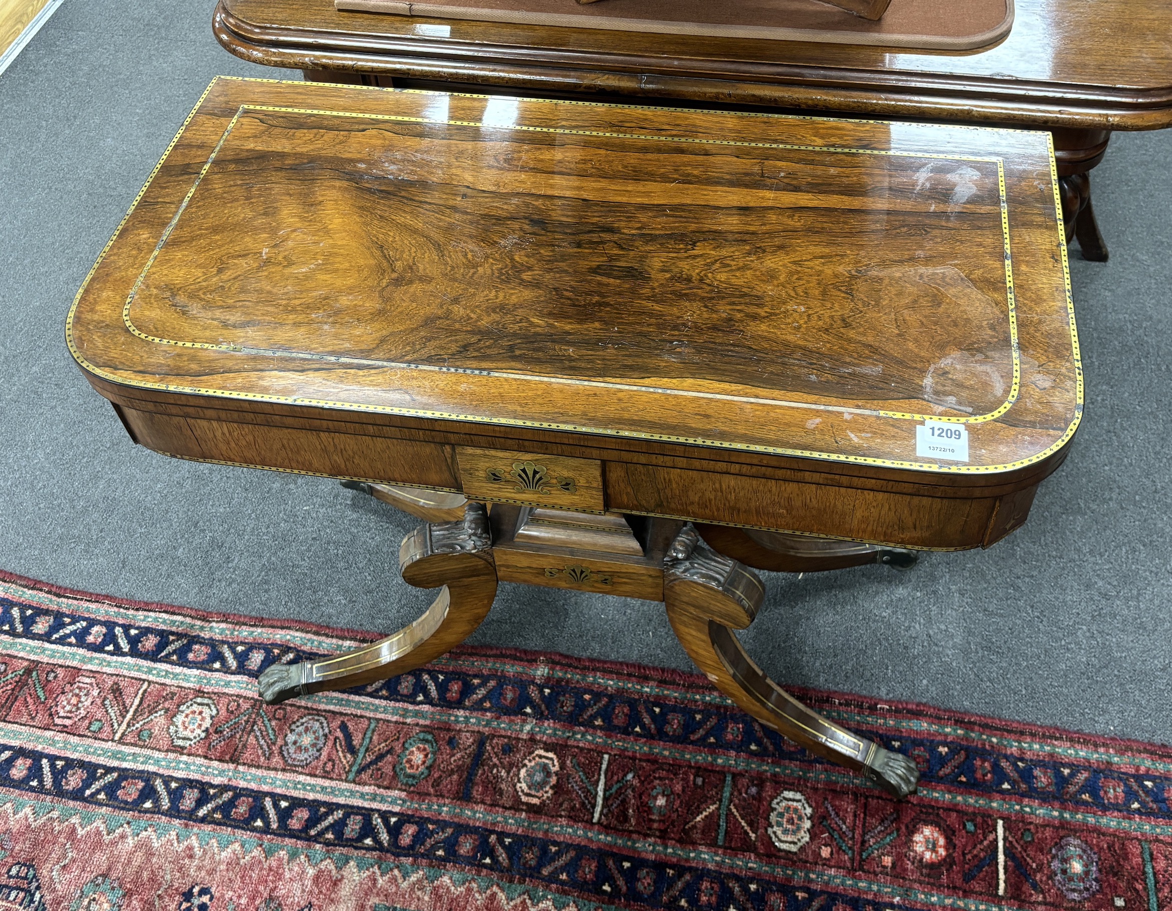 A Regency brass inlaid rectangular rosewood folding card table, width 91cm, depth 45cm, height 74cm